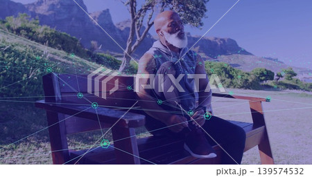 Sitting senior wearing sleeveless hoodie on park bench with earbuds, digital overlay, copy space Sitting senior wearing sleeveless hoodie on park bench with earbuds, digital overlay, copy space 139574532