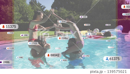 Playing friends balancing on shoulders in backyard pool, in bikinis and trunks, with social badges 139575021
