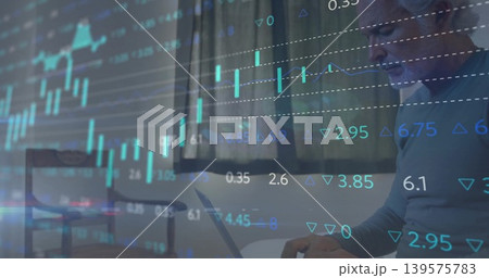 Tracking financial charts, mature man wearing light sweater using laptop in home office, copy space Tracking financial charts, mature man wearing light sweater using laptop in home office, copy space 139575783