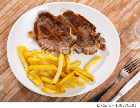 Fried pork with potatoes 139576203