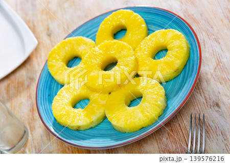 Sliced pineapple on plate 139576216
