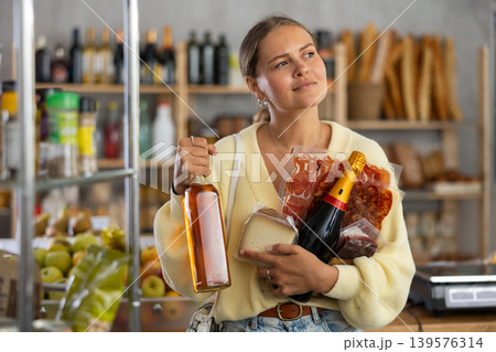 Young woman with food and champagne 139576314