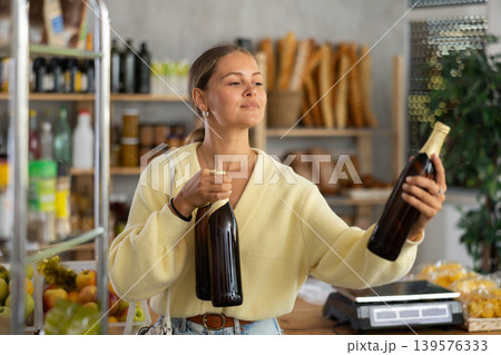 Female customer chooses beer 139576333