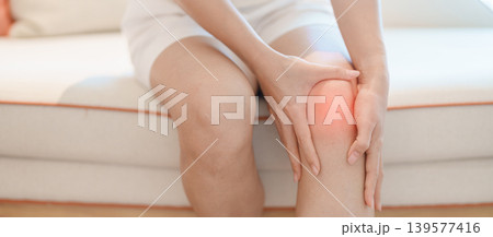 woman having knee ache and muscle pain due to Runners Knee or Patellofemoral Pain Syndrome, osteoarthritis, arthritis, rheumatism and Patellar Tendinitis. health and medical concept 139577416