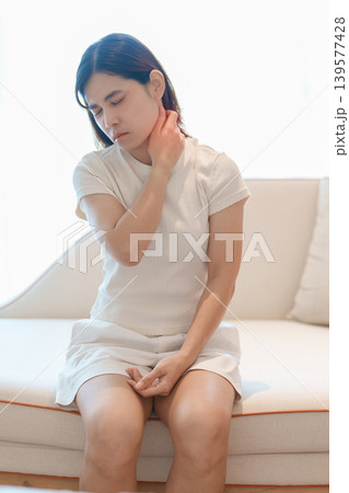 Woman having Neck pain for concepts of Neck Muscle Strain and Inflammation, Myofascial pain syndrome and Fibromyalgia, Rheumatism, Cervical Spine Spondylosis, Office Syndrome and Ergonomic 139577428