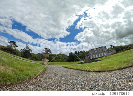 Historic country estate with formal garden and dramatic sky Historic country estate with formal garden and dramatic sky 139578613