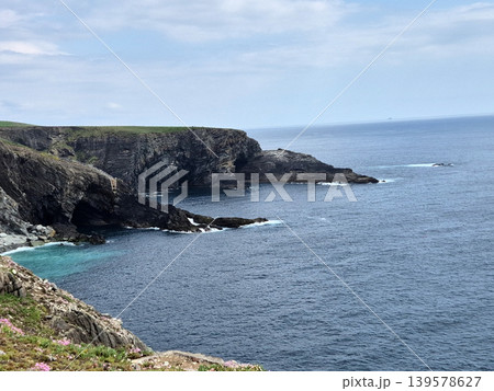 Rocky coastal cliffs and calm ocean bay Rocky coastal cliffs and calm ocean bay 139578627