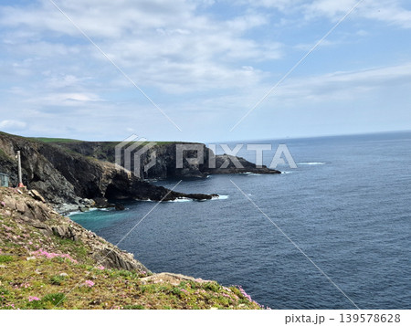 Rocky Coastal Cliffs and Calm Ocean Landscape Rocky Coastal Cliffs and Calm Ocean Landscape 139578628