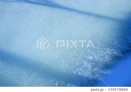 Abstract blue ice texture with snow crystals Abstract blue ice texture with snow crystals 139578669