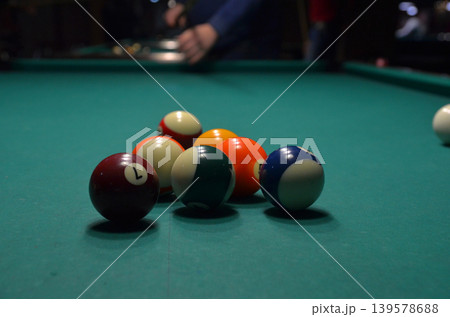 Billiard balls racked on pool table 139578688