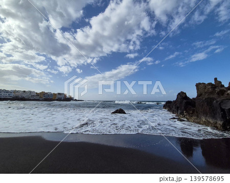 Waves Rolling Onto a Rocky Black Sand Beach Waves Rolling Onto a Rocky Black Sand Beach 139578695