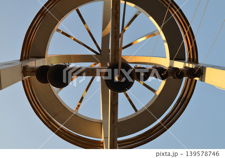 Modern metal sculpture against clear blue sky Modern metal sculpture against clear blue sky 139578746