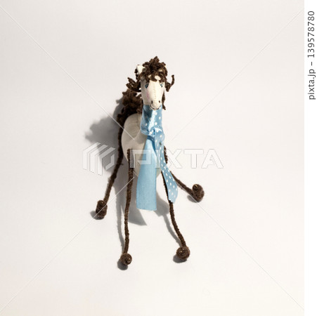 Handmade toy horse on white background Handmade toy horse on white background 139578780