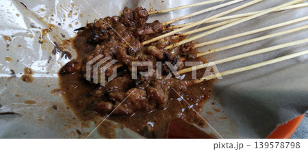 Traditional Indonesian chicken satay with peanut sauce. 139578798