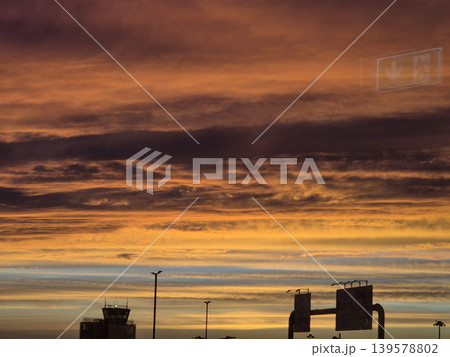 Dramatic Sunset Sky Over Airport Silhouettes 139578802