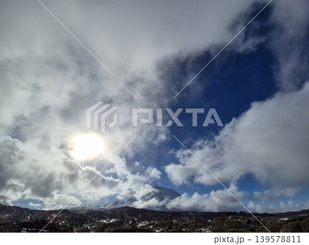 Sunlight Breaking Through Clouds Over Mountain Landscape Sunlight Breaking Through Clouds Over Mountain Landscape 139578811