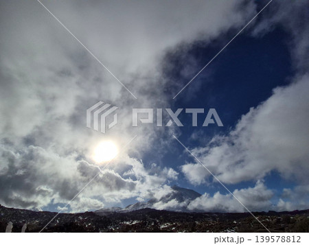Sunlight Breaking Through Dramatic Cloudy Mountain Sky Sunlight Breaking Through Dramatic Cloudy Mountain Sky 139578812