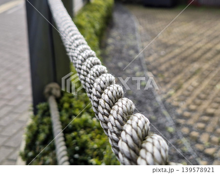 Close Up of Braided Rope Barrier Outdoors 139578921