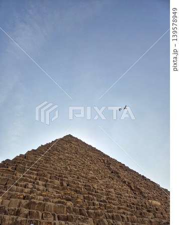 Ancient stone pyramid under clear blue sky 139578949