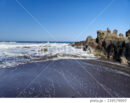 Waves Washing onto Black Sand and Rocks Waves Washing onto Black Sand and Rocks 139579007