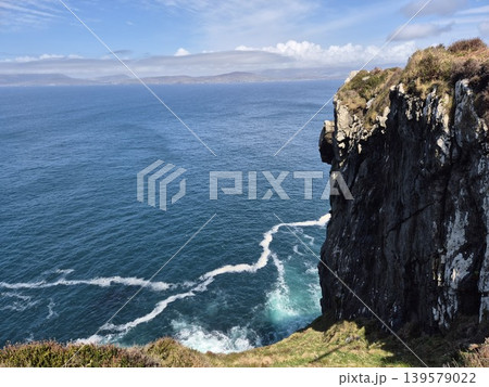 Ocean Cliff Overlooking Calm Blue Sea 139579022