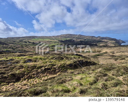 Rugged Coastal Landscape with Grassy Hills and Clouds Rugged Coastal Landscape with Grassy Hills and Clouds 139579148