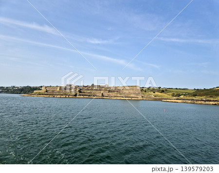 Seaside fortress overlooking calm blue water 139579203