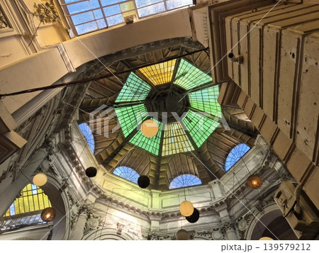 Colorful glass dome ceiling inside ornate interior Colorful glass dome ceiling inside ornate interior 139579212