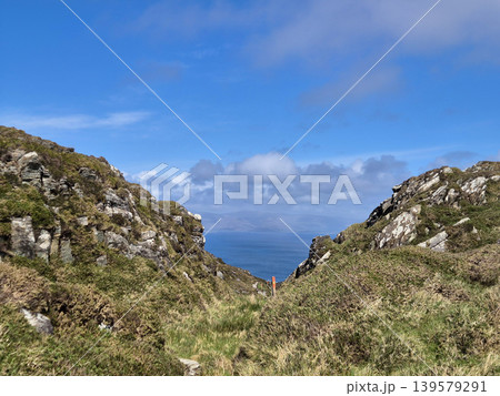 Rocky Coastal Path Between Hills and Sea 139579291