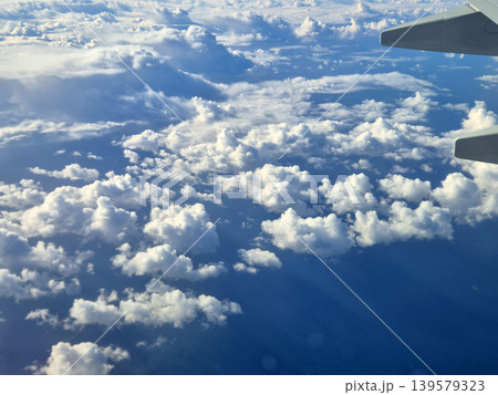 Aerial View of Clouds from Airplane Window 139579323