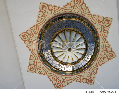 Decorative ceiling medallion with ornate circular design Decorative ceiling medallion with ornate circular design 139579354