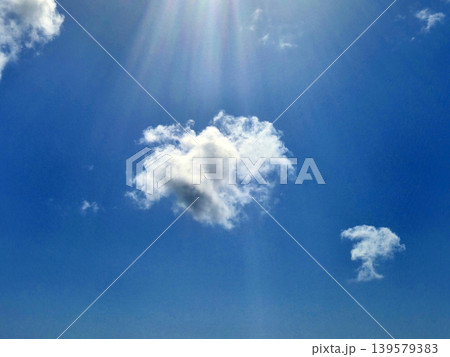 Bright blue sky with scattered white clouds Bright blue sky with scattered white clouds 139579383
