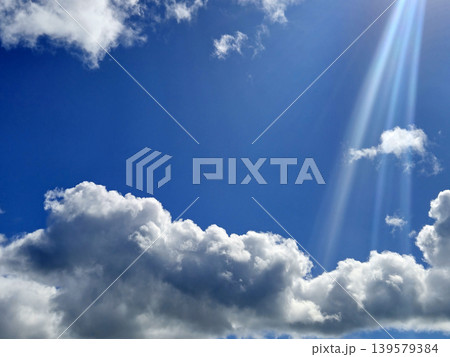 Blue Sky with Dramatic Sunlight and Clouds Blue Sky with Dramatic Sunlight and Clouds 139579384