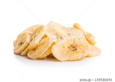Crispy Banana Chips Pile Dried Banana Snack Slices Close-Up on White Background 139580043