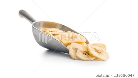 Crispy Banana Chips Scoop With Dried Plantain Slices On White Background Crispy Banana Chips Scoop With Dried Plantain Slices On White Background 139580047