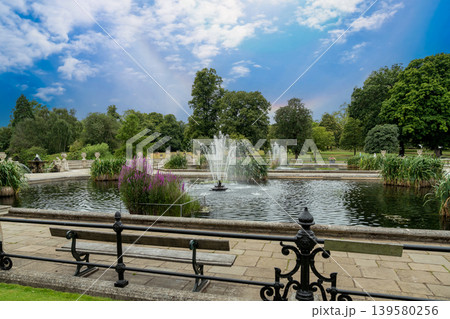 Italian garden features fountains, stone architecture, and landscaped greenery. Historic outdoor setting creates a peaceful atmosphere in central London. Italian garden features fountains, stone architecture, and landscaped greenery. Historic outdoor setting creates a peaceful atmosphere in central London. 139580256