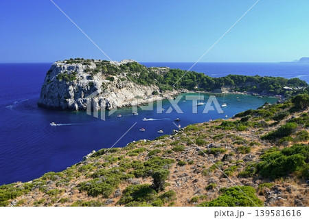 Peaceful seaside scenery on Rhodes island in Greece, clear water and relaxing summer atmosphere. Peaceful seaside scenery on Rhodes island in Greece, clear water and relaxing summer atmosphere. 139581616