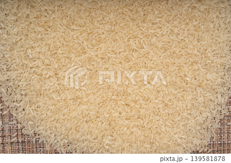 White parboiled rice grains. Dry uncooked ponni rice, small organic basmati White parboiled rice grains. Dry uncooked ponni rice, small organic basmati 139581878