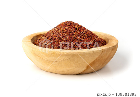 Rooibos tea leaves isolated in wood bowl Rooibos tea leaves isolated in wood bowl 139581895