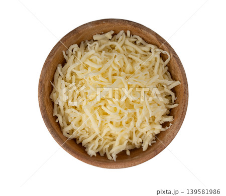 Grated mozzarella cheese. Shredded mozarella texture Grated mozzarella cheese. Shredded mozarella texture 139581986