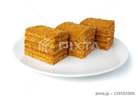 Honey cake isolated, medovik dessert piece Honey cake isolated, medovik dessert piece 139582008