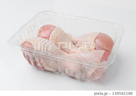 Raw Chicken Drumsticks in a Plastic Container Isolated, Uncooked Poultry Legs, Fresh Hen Meat Raw Chicken Drumsticks in a Plastic Container Isolated, Uncooked Poultry Legs, Fresh Hen Meat 139582190