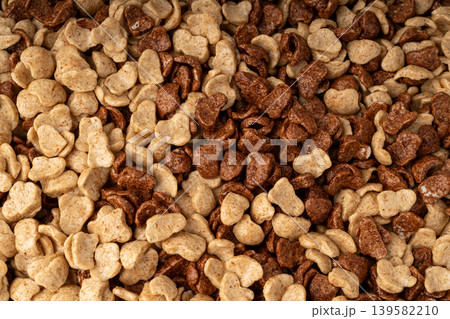 Chocolate cereal flakes texture background, rice crispy breakfast pattern Chocolate cereal flakes texture background, rice crispy breakfast pattern 139582210
