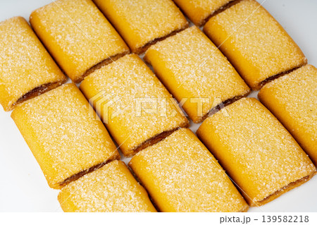 Fig roll bar, square sugar cookies with fruit filling isolated Fig roll bar, square sugar cookies with fruit filling isolated 139582218