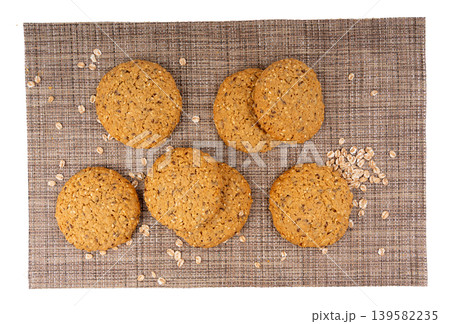 Whole and broken oatmeal cookies, cereal biscuits, fitness bakery Whole and broken oatmeal cookies, cereal biscuits, fitness bakery 139582235