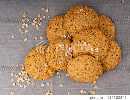 Whole and broken oatmeal cookies, cereal biscuits, fitness bakery Whole and broken oatmeal cookies, cereal biscuits, fitness bakery 139582241