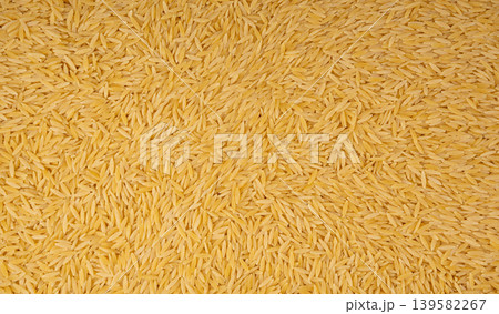 Raw orzo pasta, risoni or kritharaki pile Raw orzo pasta, risoni or kritharaki pile 139582267