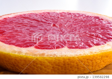 Macro texture of red grapefruit, citrus pulp closeup pattern Macro texture of red grapefruit, citrus pulp closeup pattern 139582298