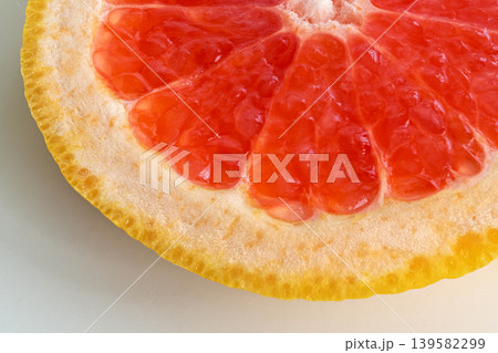 Macro texture of red grapefruit, citrus pulp closeup pattern Macro texture of red grapefruit, citrus pulp closeup pattern 139582299