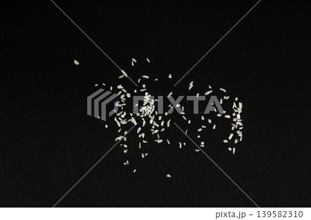 Grated coconut powder. Dry coco flakes pile, shredded desiccated coconut, tropical fruit chips 139582310